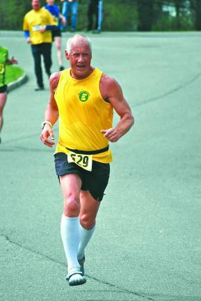 Local runners are Boston bound Photo provided Karl Fenske running a local race and wearing a Team Eastern jersey.
