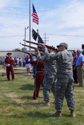 Township’s annual veteran’s tradition continues The Honor Guard firing three rounds.