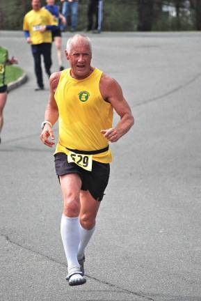 Local runners are Boston bound Photo provided Karl Fenske running a local race and wearing a Team Eastern jersey.