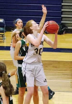 Jefferson's Shelby Murawinski rises towards the basket with the ball.