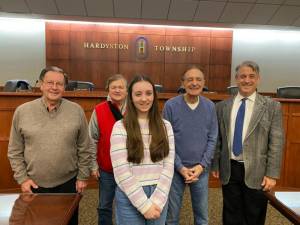 Lily Tobachnick poses with members of the Hardyston Township Council at their Feb. 22 meeting. (Photo by Laura J. Marchese)