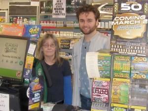 Linda Storms and Carl Contino are ready at the NJ Lottery’s Green Machine at the Highland Lakes General Store.