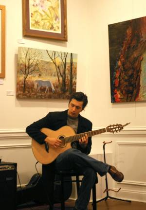 Music for the art show reception was provided by Nick Giardina who performed tunes from around the world.