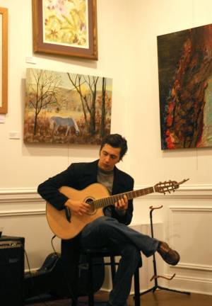 Skylands Gallery show benefits Father John's Animal House Music for the art show reception was provided by Nick Giardina who performed tunes from around the world.