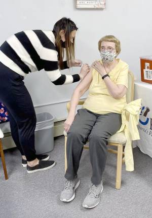 Betty Van Orden receives her vaccine