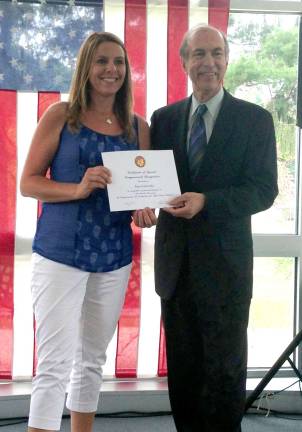 Amy Fairweather receives a certificate of congressional recognition from U.S. Rep. Scott Garrett.
