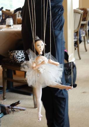 Prima ballerina-marionette, Puppenskaya rehearsing in the restaurant of at the Lake Mohawk Golf Club.