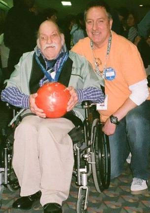 Special Olympics bowler Pau Muller is shown with volunteere Ed Ruf, who has been a volunteer for more than 28 years. Ruf recently won the Special Olympics of New Jersey Volunteer of the Year award for 2014.