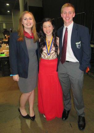 Wallkill Valley FBLA Secretary and New Jersey Northern Region Vice President Ana Schroeder, left, and Wallkill Valley FBLA Co-President and New Jersey State President Scott Mueller, right, congratulate Vanessa Ting, the New Jersey candidate who was elected the 2016-2017 national secretary. Mueller served as campaign manager.