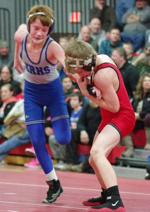 High Point's Devin Flannery grabs the arm of Kittatinny's Derek Molfetto in the 106-pound weight class.