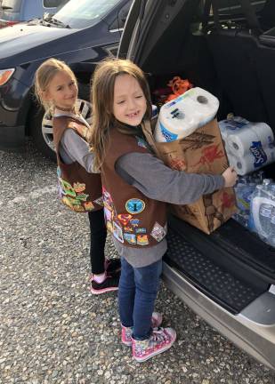 Girl Scouts drop off donation to preschool