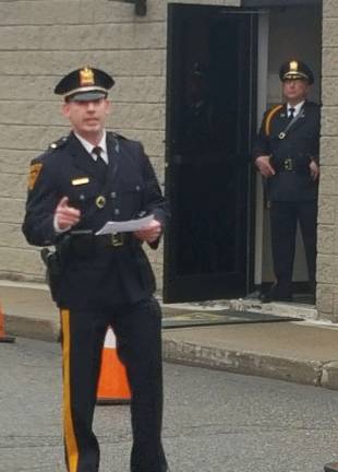 Lt Cugliari welcomes crowd as Chief McInerney stands ready for celebration walk.