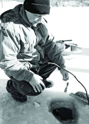 Photo by Nick Ortiz Mike Bender member of the friends of High Point State Park ice fishing demostration during winter festival.