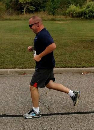 Sussex County Sheriff Mike Strada runs in last year's Crimestoppers race.