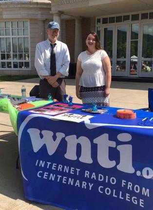Katie Peters of Lafayette, standing with WNTI General Manager Richard Hinchliffe, organized the car show along with Justin Dalcourt.