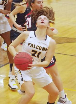 Jefferson's Leah Demko holds the ball as she looks up at the hoop just before a shot attempt in the first quarter. Demko scored 6 points.