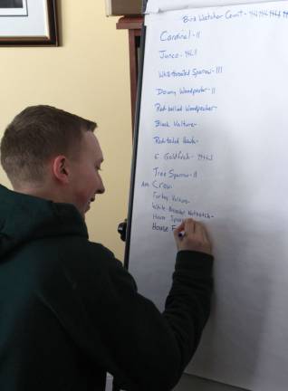 Tim Paziora of Newton keeps track on the Bird Watcher Count Chart at Wallkill Refuge on Sunday.