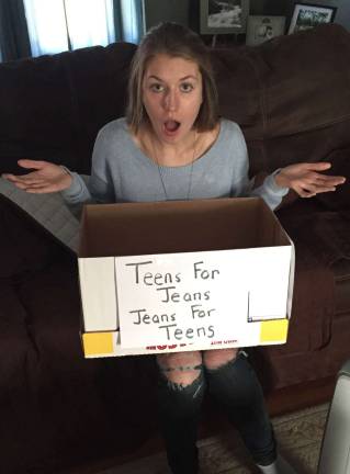 Kassidy Wagner is shown with an empty box she planned to use for her Teens for Jeans drive.