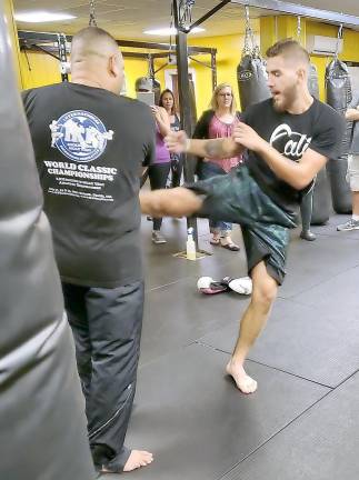 Johnmichael Brancaccio demonstrates a kick.