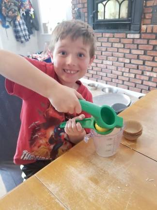 Hunter Schmick makes lemonade for the business he founded to raise money for his goats (Photo provided)