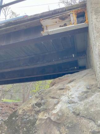 The white rectangle on the underside of the bridge shows the rust and decay of the steel girders, and it appears part of the bridge is actually missing. (Photo provided by Melissa Mullins)