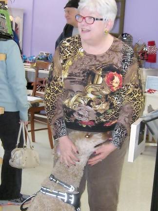 Shop owner Bonnie Bitondo greets one of her canine customers.