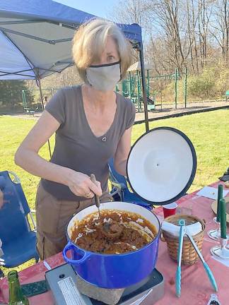 MaryAnne Choma serves up some pumpkin turkey chili (Photo by Laurie Gordon)