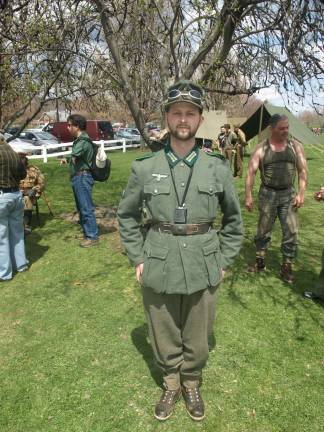Military vehicles, troops occupy fairgrounds Michael Wilder of West Milford as a German Gebirgsjager (alpine or mountain soldier).