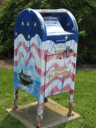 PHOTO BY JANET REDYKE This dispenser at the Sussex Wantage Library is for retired American flags. Collected flags will be honorably disposed of.