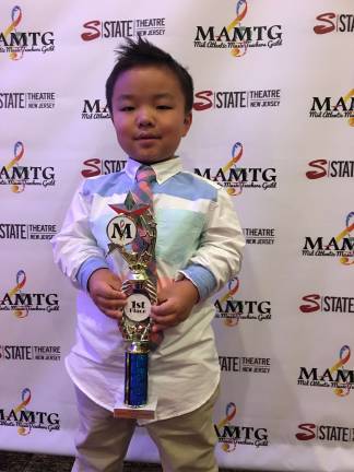 Young guitarist Ethan Barnett (9 years old, 3rd Grade, Hardyston Elementary) of the David Poli Music from Hamburg, recently won first place in Guitar Open Pop Solo categories at the Mid Atlantic Music Teacher Guild competition (April 14). This is second time he entered the MAMTG competition and he won first place both of times. Ethan Barnett performed "I’m yours" by Jason Mraz on the ukulele and vocals.