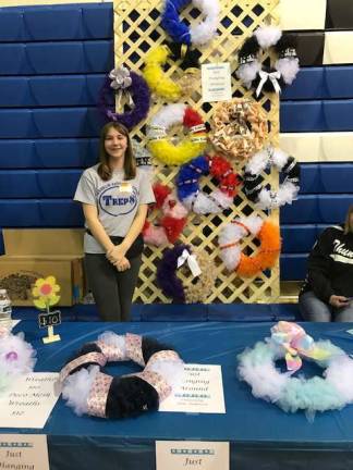Seventh Grade &#x201c;Just Hanging Around&#x201d; business owner Erin Anderson sold homemade wreathes at the TREP$ Marketplace!