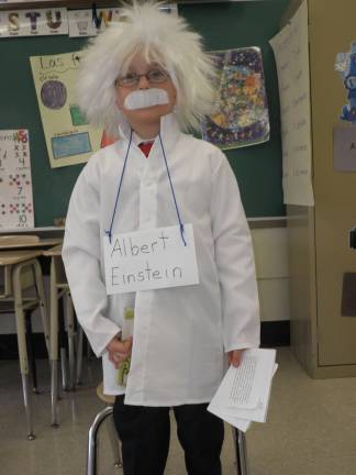 Students bring famous figures to life through 'wax musuem' Luke Derenzo as Albert Einstein.