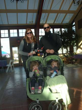 Walking for premature babies Photos by John Church Pictured from left, standing: Jessica and Jason Soehngen of Sparta, with their twin girls Olivia (left) and Amilia, who were born premature, staying warm in the Sussex County Fairgrounds Conservatory Building.