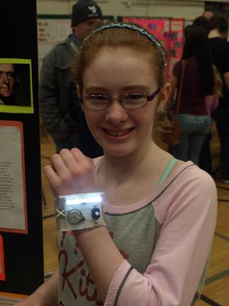 Students get thinking at science fair Photos by John Church Arielle McCouch, 12, wearing her wrist flashlight.