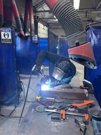 From classroom to career <b>A member of SCCC’s welding program is hard at work.</b>