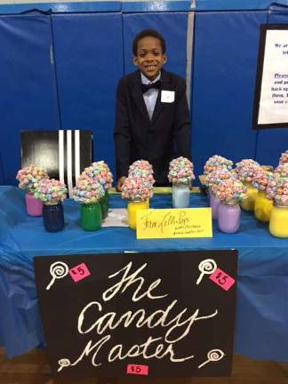 Franklin students hold TREP$ Marketplace The þÄúCandy MasterþÄù Ivan Hicks sells his Mason jar lollipop trees.