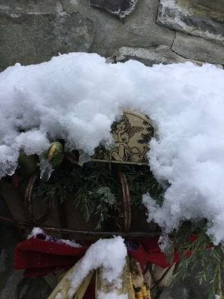 This photo sent by Alana Steib of Stockholm shows snow on top of of the porch Thanksgiving decorations. Recorded snowfall totaled 4.7 inches in the area.