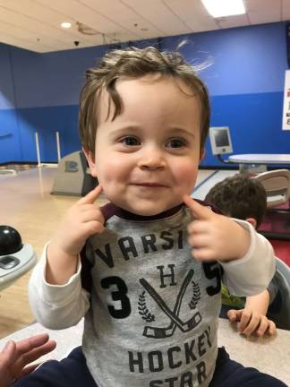Mason. The happiest guy in the bowling alley! Photo courtesy of Kali.
