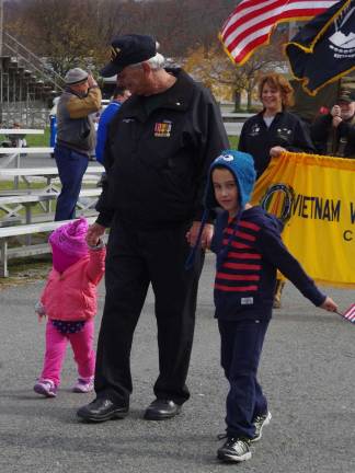 John Harrigan of Vernon is shown marching with his grandchildren Matthew Celetano, 6, and his sister 21-month-old Zoey Celetano. As president of the local Vietnam Veterans of America chapter, Harrigan has been the driving force behind the creation and establishment of the Sussex County veteran's cemetery in Sparta, which will have it&#xfe;&#xc4;&#xf4;s grand opening in Sparta on November 15 at 11 a.m.