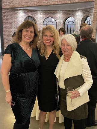 Event raises funds for SCCC scholarships SCCC board members Candice Smith, left, and Maryanne Fox, right, stand with Heidi Weber, SCCC Foundation board member.