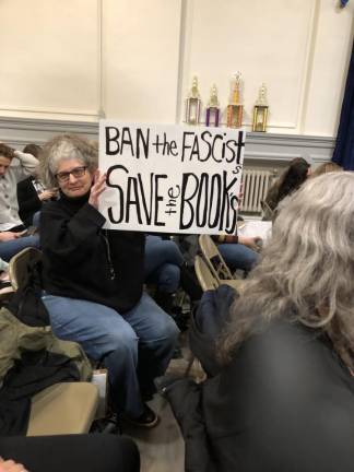 UPDATE: School board removes book from middle school Simonetta Jean of Sparta holds up a sign at the Board of Education meeting Thursday, Feb. 23.