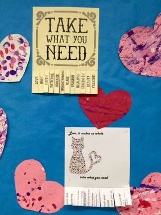 Ms. Cooke's fifth-grade study skills class made a bulletin board with &quot;Take what you need&quot; posters.