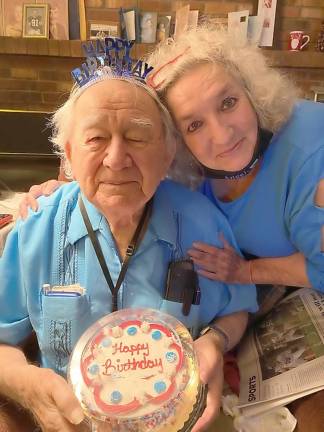 Former Hamburg mayor John Yanish is shown with his caregiver, Helen.