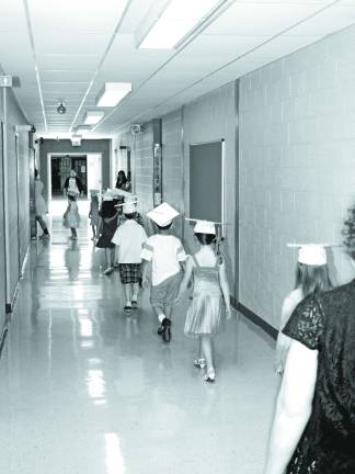 The kindergarten class of 2014 lining up in the hallway before the graduation ceremony.