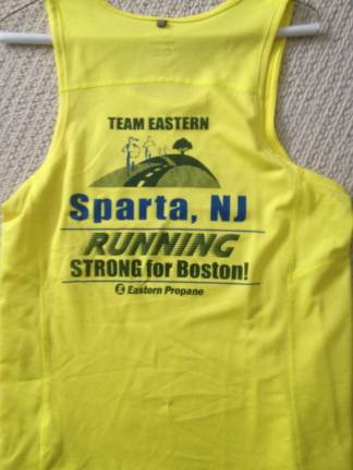 Photo By Laura Delea Team Eastern runners will be sporting this yellow singlet at the Boston Marathon.