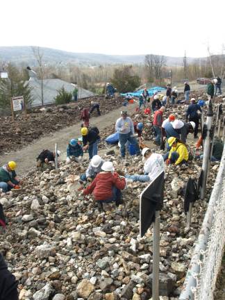 Chipping away for treasure Photos by John Church Rock hounds searching through the Mine Run Dump for specimens.