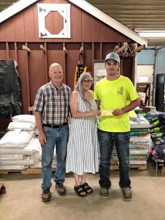 Gigante wins scholarship Sussex County Board of Agriculture president Mike Burger and Natalie Burger present Joseph Gigante of Andover with the Gracie’s Scholarship $500 check toward his education. (Photo provided)