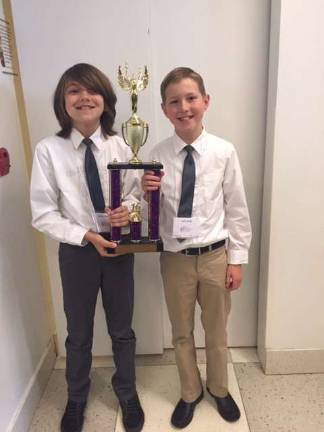 Enrichment class students honored Jack Veith and Jackson Moller with their trophy.