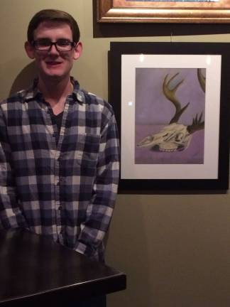 Photos by Laurie Gordon Zack Greene, a senior at Kittatinny Regional High School, stands with his painting