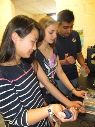 Photo by Viktoria-Leigh Wagner From left, seniors Brinley Burdge of Lafayette, Catherine Henckel of Sussex and Sahil Suri of Augusta work on their independent study projects.